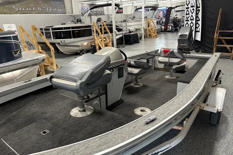 Slide: The Image of Control panel of a 1994 Alumacraft Classic 165 CS boat with switches and display. - 11