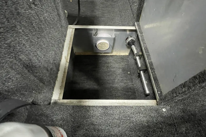 Slide: The Image of Open storage compartment in 1994 Alumacraft Classic 165 CS boat interior. - 15