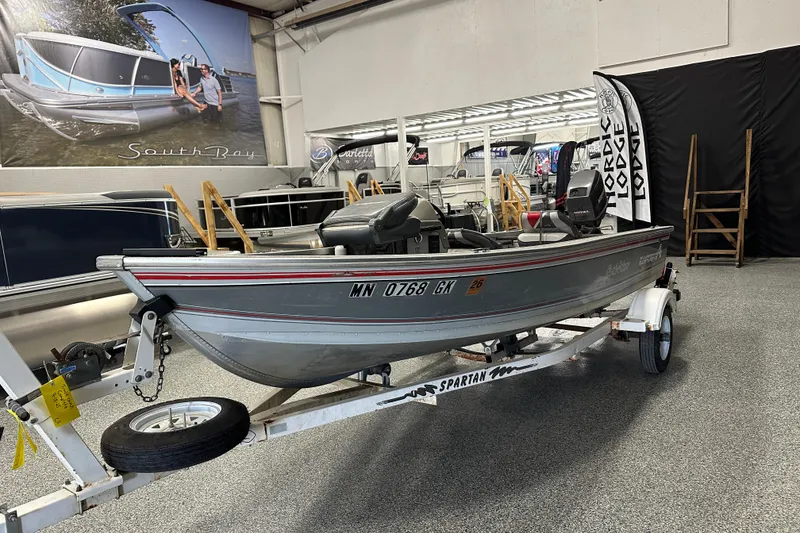 Slide: The Image of 1994 Alumacraft Classic 165 CS boat with Mariner motor in showroom. - 3