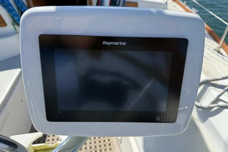 Slide: The Image of Raymarine navigation display on a 1997 Tartan 3800 sailboat deck. - 15