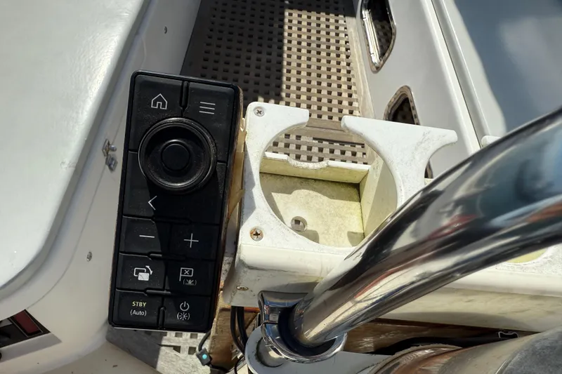 Slide: The Image of Control panel and cup holder on a 1997 Tartan 3800 yacht deck. - 17