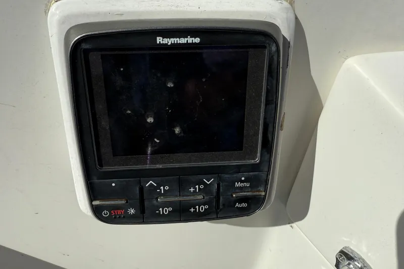 Slide: The Image of Raymarine navigation system on 1997 Tartan 3800 yacht, featuring control buttons and display. - 18
