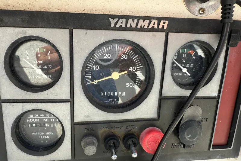 Slide: The Image of Control panel of a 1997 Tartan 3800 with Yanmar engine gauges and meters. - 20
