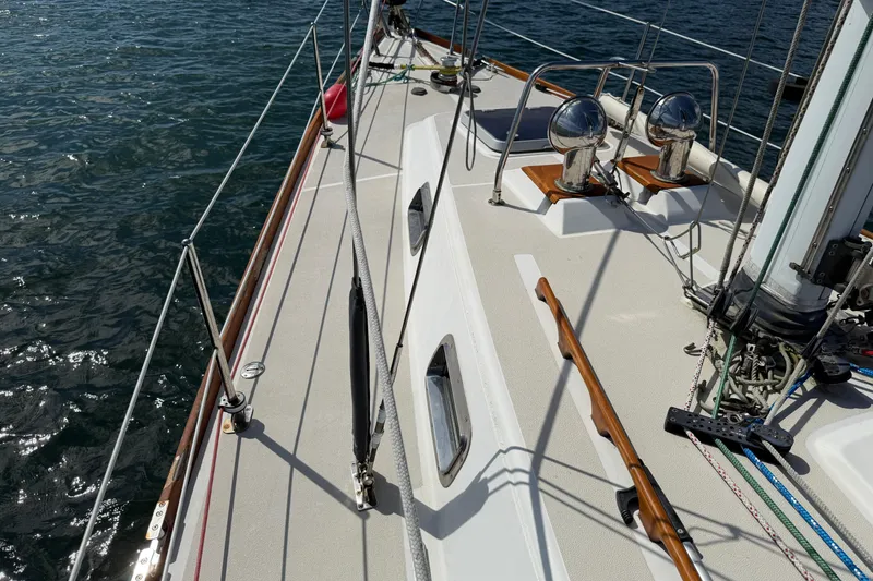 Slide: The Image of Deck view of a 1997 Tartan 3800 sailboat with polished fittings and rigging. - 32