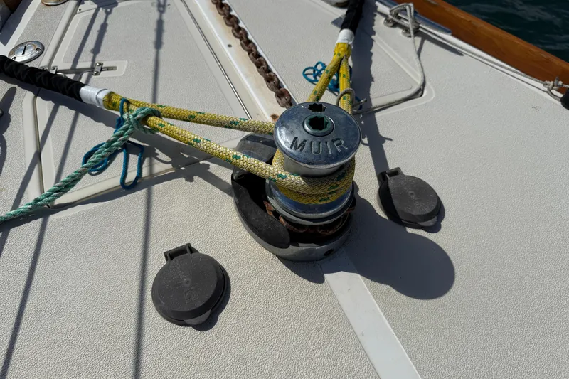 Slide: The Image of Deck of 1997 Tartan 3800 sailboat featuring Muir winch and ropes. - 34