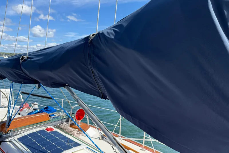 Slide: The Image of Sailboat with covered boom, Tartan 3800, 1997 model, on a sunny day. - 40