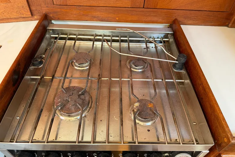 Slide: The Image of Rusty Tartan 3800 stove from 1997 with four burners and metal grates. - 58