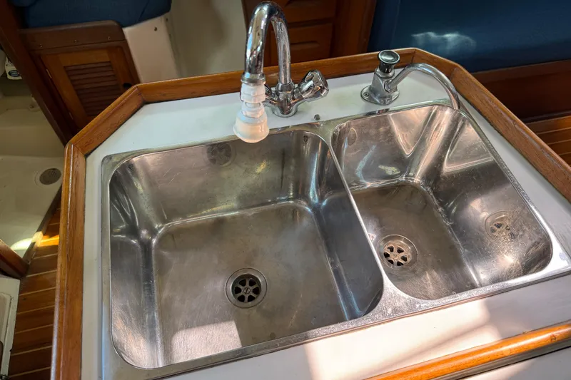 Slide: The Image of Stainless steel double sink in 1997 Tartan 3800 yacht galley. - 64