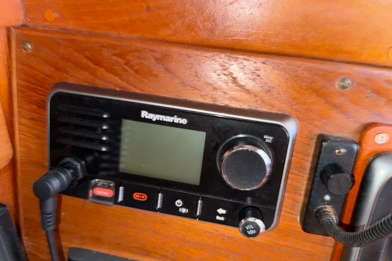 Slide: The Image of Raymarine marine radio on 1997 Tartan 3800 sailboat, mounted on wooden panel. - 76