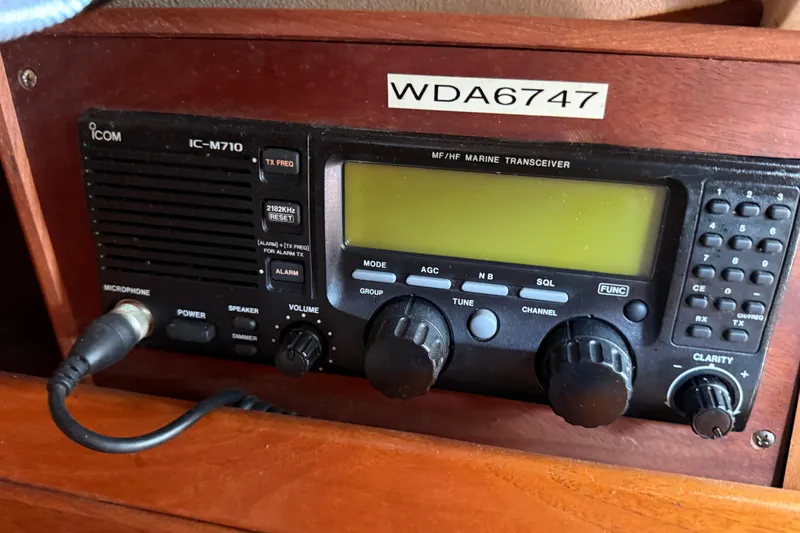 Slide: The Image of Marine transceiver Icom IC-M710 on 1997 Tartan 3800 sailboat dashboard. - 81