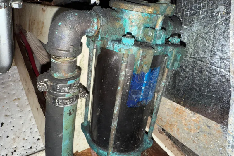 Slide: The Image of Rusty Tartan 3800 pump from 1997 with corroded pipes and clamps. - 89