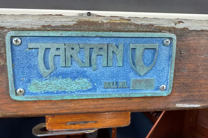 Slide: The Image of Plaque of 1997 Tartan 3800 sailboat, showing model and hull number. - 91