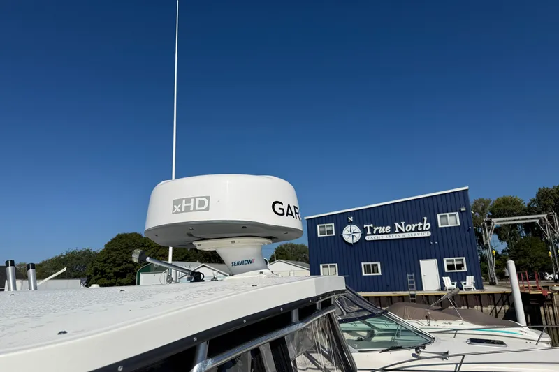 Slide: The Image of 2002 Carolina Classic 28 boat with Garmin radar, near True North Yacht Sales building. - 5