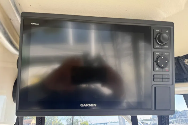 Slide: The Image of Garmin GPS display on a 2002 Carolina Classic 28 boat dashboard. - 9