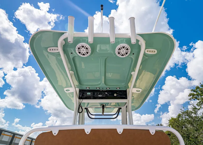 Slide: The Image of 2026 Sea Hunt Ultra 239 boat top view against a bright blue sky. - 16