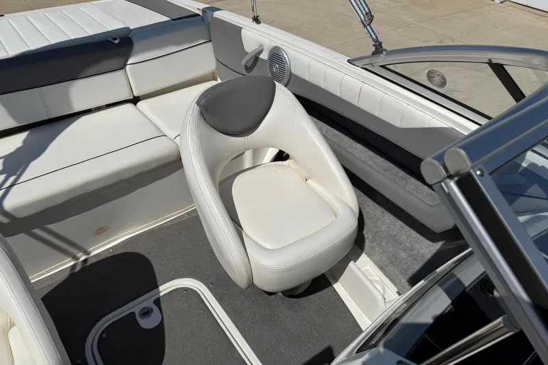 Slide: The Image of 2014 Bayliner 185 Bowrider interior with white seating and gray accents. - 13