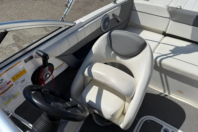 Slide: The Image of 2014 Bayliner 185 Bowrider interior with steering wheel and seating. - 14