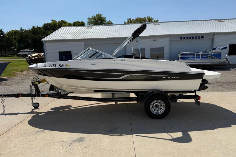 Slide: The Image of 2014 Bayliner 185 Bowrider boat on trailer outside showroom. - 3