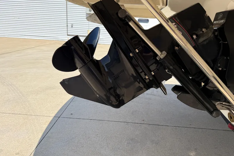 Slide: The Image of 2014 Bayliner 185 Bowrider boat propeller and outdrive close-up. - 7