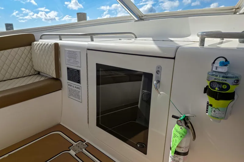 Slide: The Image of 2005 Buddy Davis 35' Express boat interior with seating, storage, and safety equipment. - 11