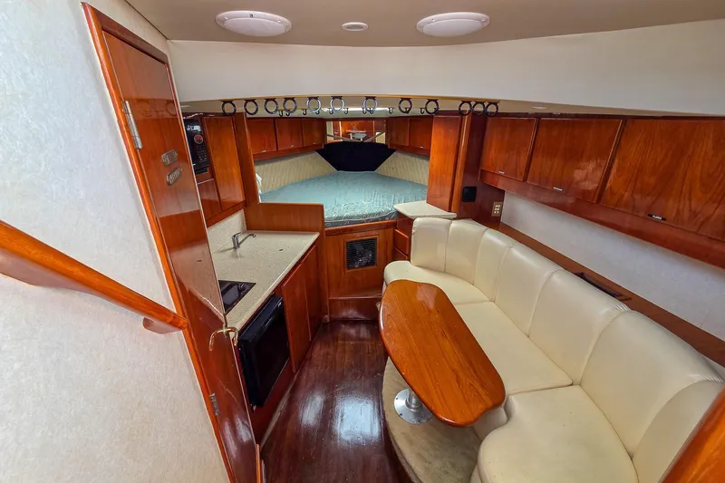 Slide: The Image of Luxurious interior of 2005 Buddy Davis 35' Express yacht with cozy seating and kitchenette. - 16