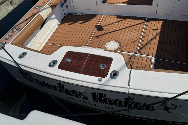 Slide: The Image of 2005 Buddy Davis 35' Express boat docked, aerial view, featuring spacious deck and fishing equipment. - 2
