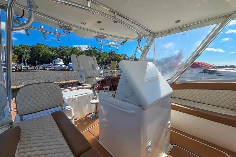 Slide: The Image of Interior of 2005 Buddy Davis 35' Express yacht with luxurious seating and helm station. - 25