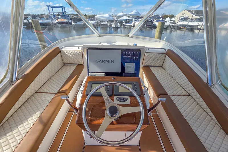 Slide: The Image of Helm of 2005 Buddy Davis 35' Express with Garmin navigation, docked at marina. - 27
