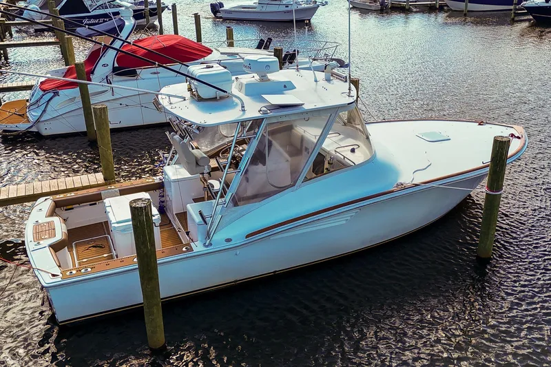 Slide: The Image of 2005 Buddy Davis 35' Express boat docked in a marina, aerial view. - 33