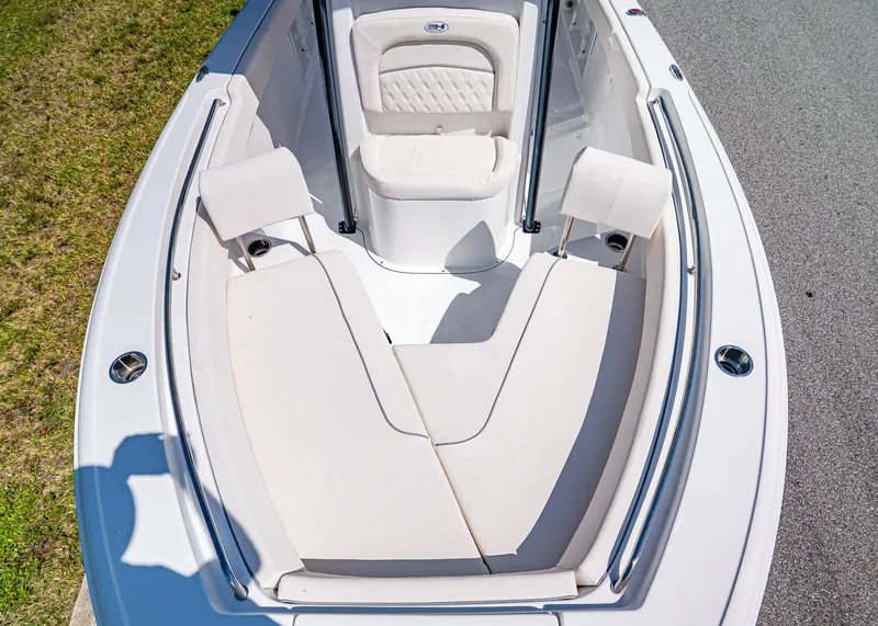 Slide: The Image of 2026 Sea Hunt Ultra 219 boat interior with cushioned seating and sleek design. - 23