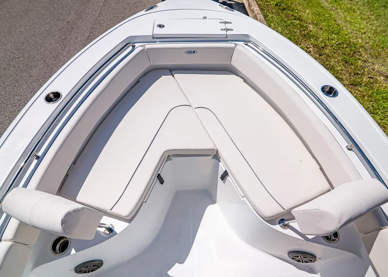 Slide: The Image of 2026 Sea Hunt Ultra 219 boat with spacious, cushioned seating area. - 26