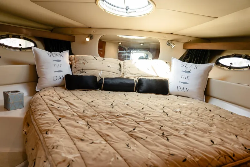 Slide: The Image of Luxurious cabin interior of 2008 Regal Commodore 4060 yacht with cozy bedding. - 18