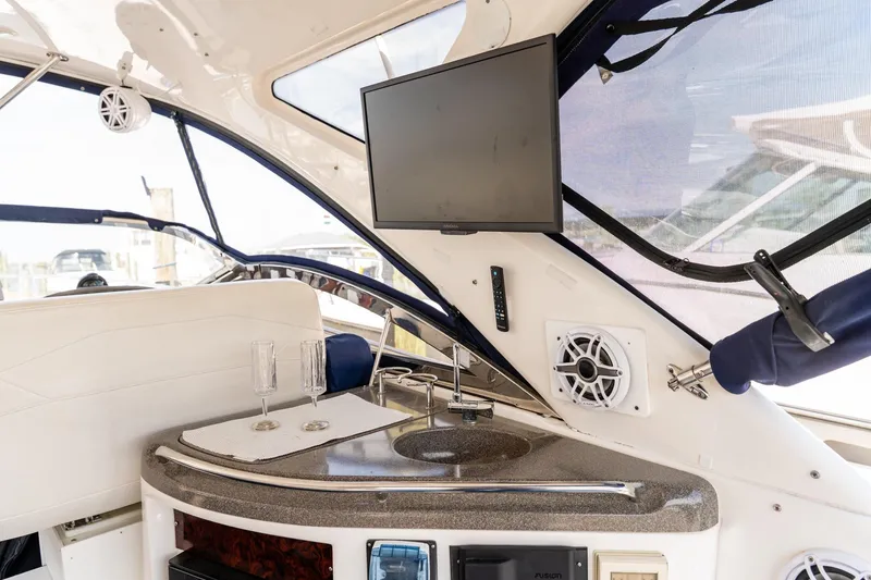 Slide: The Image of Luxurious interior of 2008 Regal Commodore 4060 yacht with TV and sink. - 8