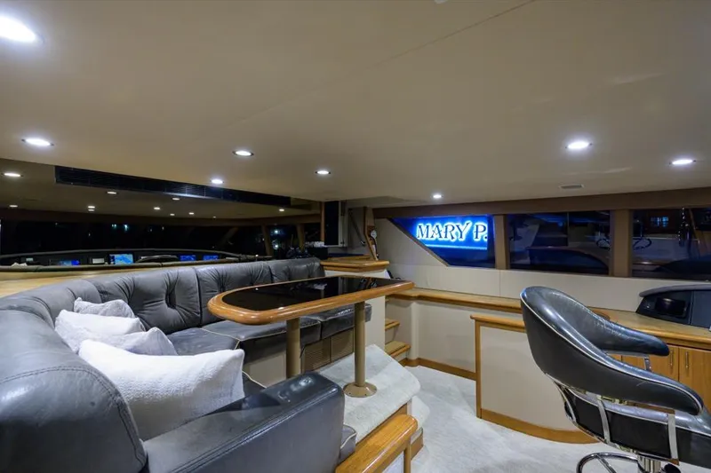 Slide: The Image of Luxurious interior of 2001 Westport Motor Yacht Raised Pilothouse with leather seating and elegant decor. - 11