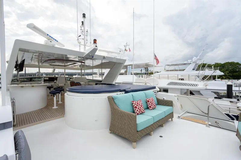 Slide: The Image of Luxurious 2001 Westport Motor Yacht Raised Pilothouse with outdoor seating and hot tub. - 17