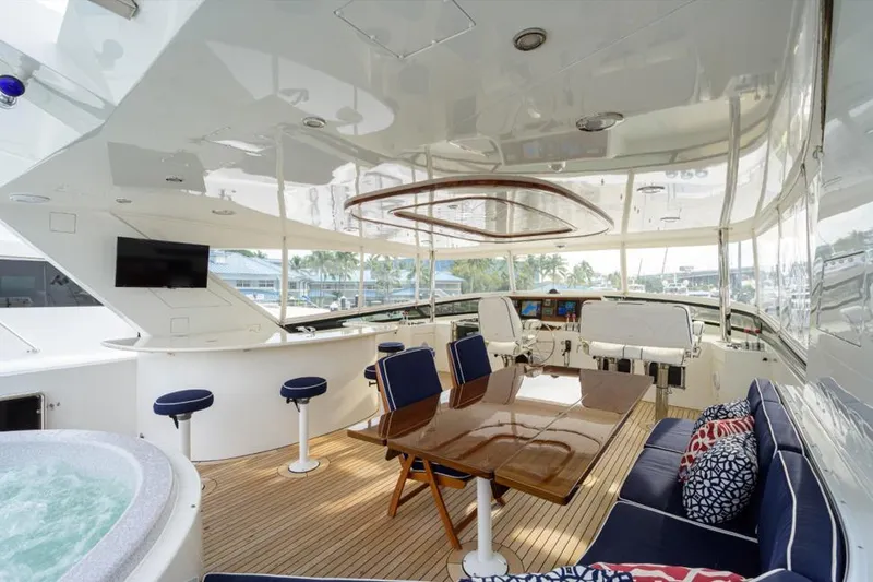 Slide: The Image of Luxurious 2001 Westport Motor Yacht Raised Pilothouse interior with seating, table, and jacuzzi. - 22