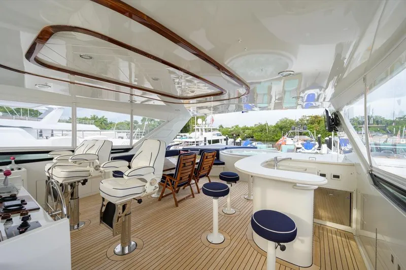 Slide: The Image of Luxurious 2001 Westport Motor Yacht Raised Pilothouse with elegant seating and bar area. - 24