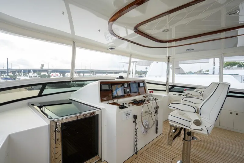 Slide: The Image of Luxurious 2001 Westport Motor Yacht Raised Pilothouse interior with helm and seating. - 26