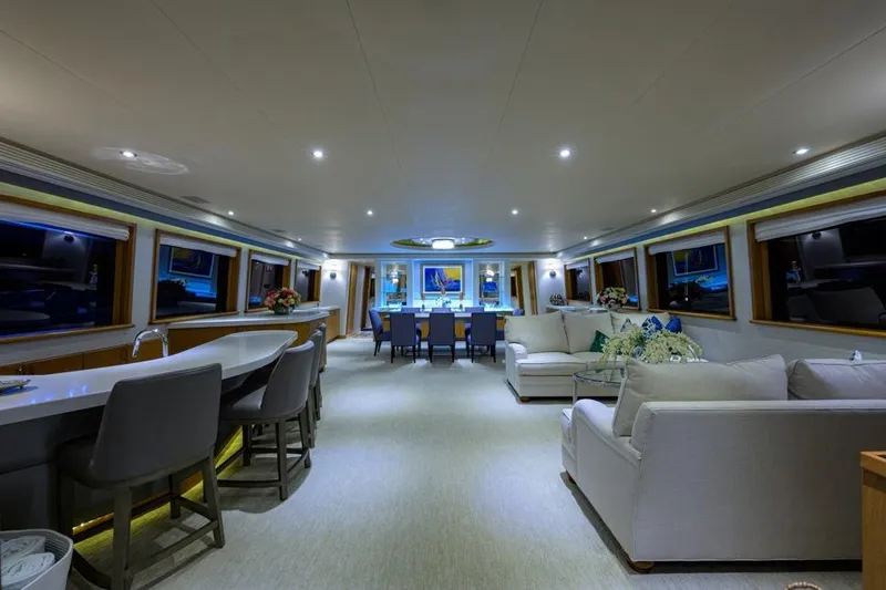 Slide: The Image of Luxurious interior of 2001 Westport Motor Yacht Raised Pilothouse, featuring elegant seating and dining area. - 28