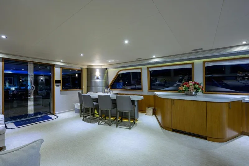 Slide: The Image of Luxurious interior of 2001 Westport Motor Yacht Raised Pilothouse with elegant dining area. - 31