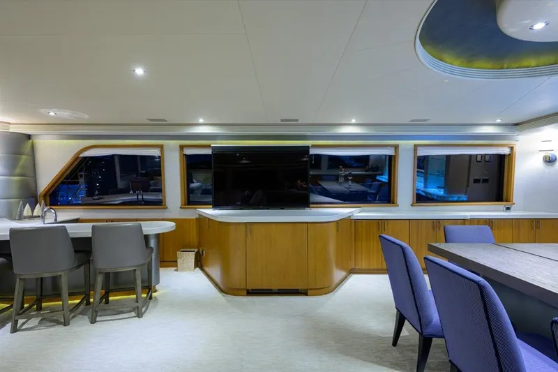 Slide: The Image of Luxurious interior of 2001 Westport Motor Yacht Raised Pilothouse with modern furnishings and large windows. - 34