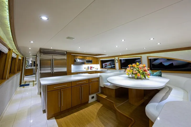 Slide: The Image of Luxurious interior of 2001 Westport Motor Yacht Raised Pilothouse with elegant dining area and kitchen. - 37
