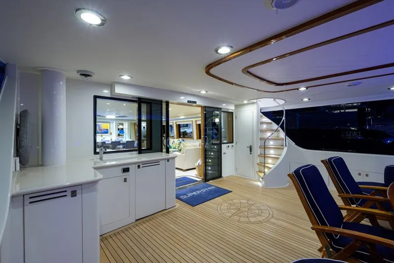 Slide: The Image of Luxurious 2001 Westport Motor Yacht Raised Pilothouse interior with elegant seating and modern lighting. - 4