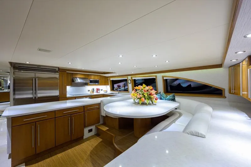 Slide: The Image of Luxurious interior of 2001 Westport Motor Yacht Raised Pilothouse with modern kitchen and dining area. - 41