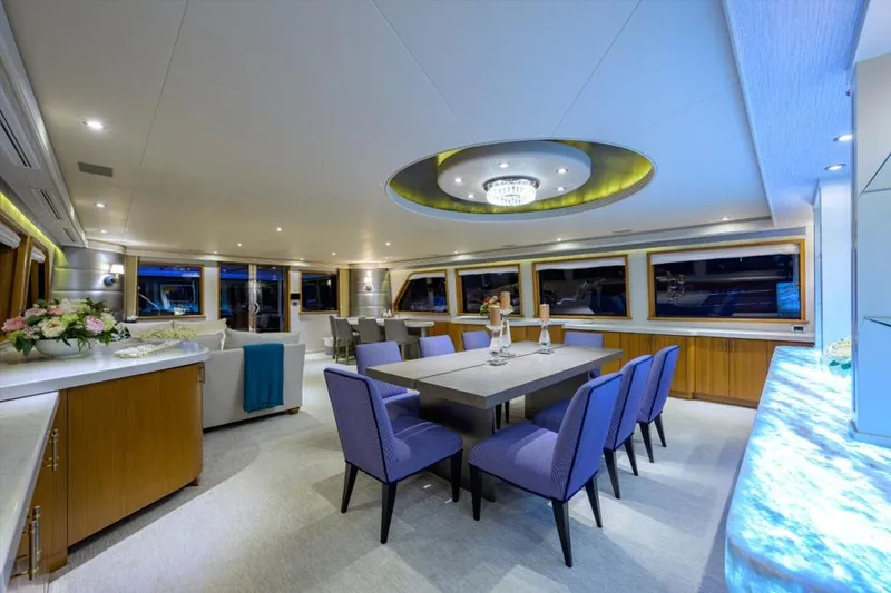Slide: The Image of Luxurious interior of 2001 Westport Motor Yacht Raised Pilothouse with elegant dining area. - 43