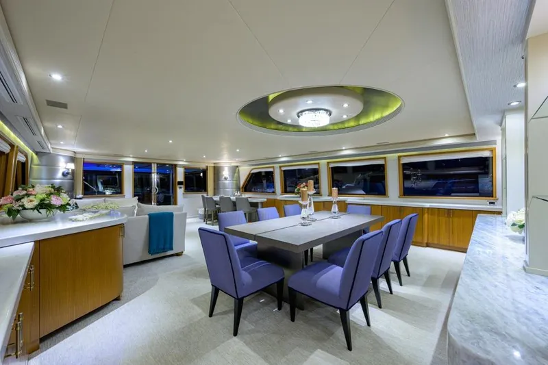 Slide: The Image of Luxurious interior of 2001 Westport Motor Yacht Raised Pilothouse with elegant dining area. - 44