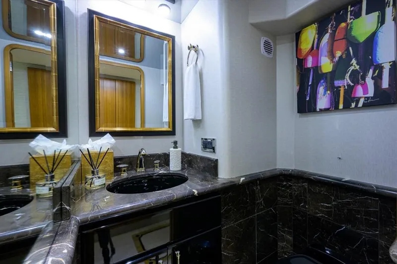 Slide: The Image of Luxurious bathroom in 2001 Westport Motor Yacht with marble countertop and modern decor. - 46