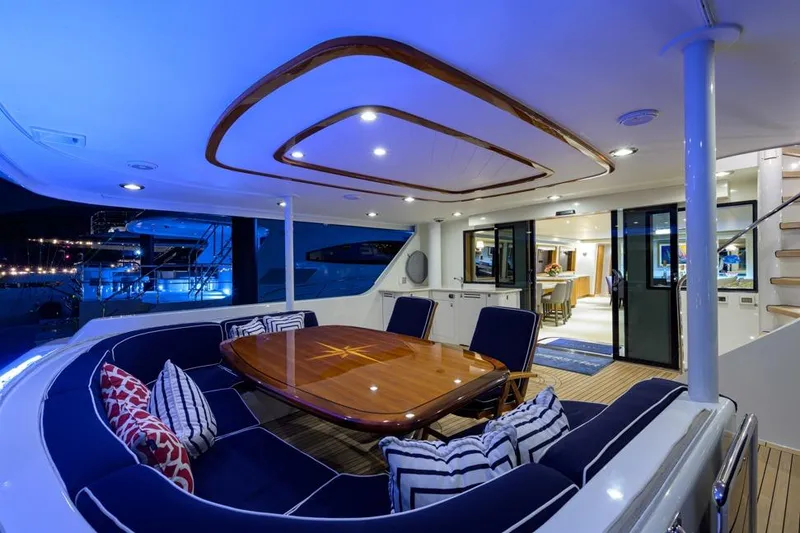 Slide: The Image of Luxurious 2001 Westport Motor Yacht Raised Pilothouse with elegant outdoor dining area. - 5