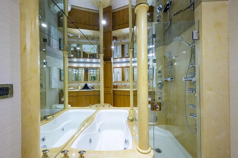Slide: The Image of Luxurious bathroom in 2001 Westport Motor Yacht Raised Pilothouse with jacuzzi and glass shower. - 52