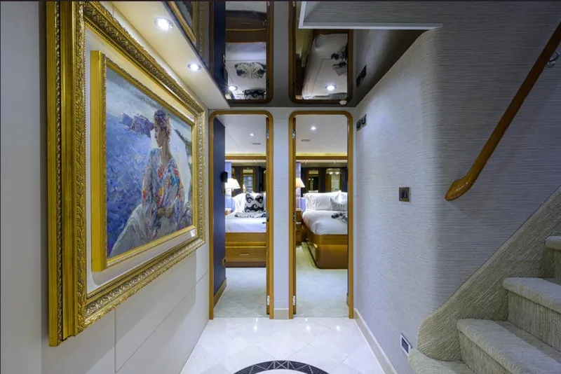 Slide: The Image of Luxurious interior of 2001 Westport Motor Yacht with elegant artwork and plush bedroom. - 54